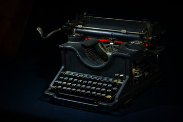 Ancient  typewriter on a black background