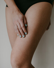 woman hips and hand in black underwear