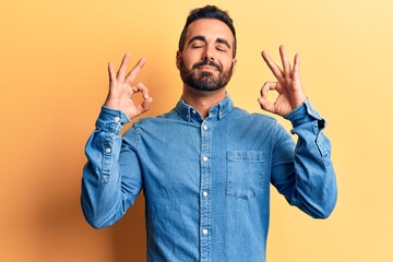 Young hispanic man wearing casual clothes relax and smiling with eyes closed doing meditation gesture with fingers. yoga concept.