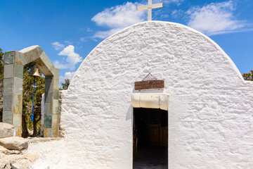 White chapel with bell tower on the hill of Monolithos castle on Rhodes island. Greece