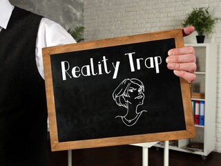 Motivation concept meaning Reality Trap with sign on the page.