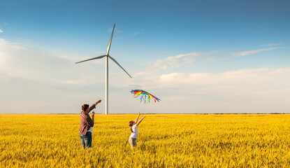 father and daughter having fun, playing with kite together © Inna Vlasova