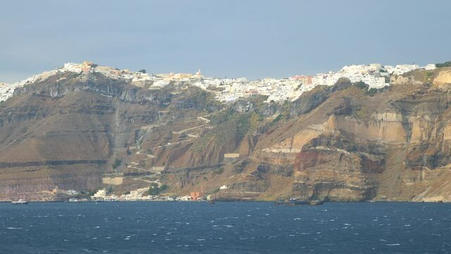 Slow motion shot of a scenic beautiful Greek island from a moving ferry