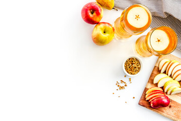 Fruit drinks with apple and pear on white background from above copy space