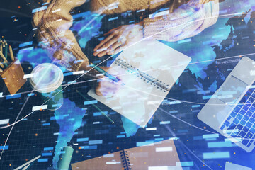 Double exposure of writing hands on background with data solution hologram on front. Technology concept. Close up