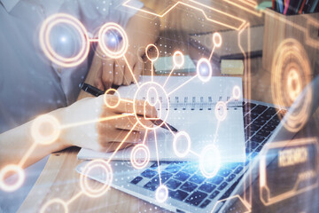 Social network theme hologram over woman's hands writing background. Concept of international people connect. Double exposure