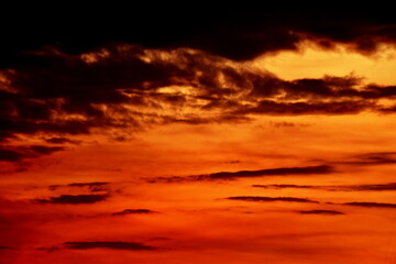 Fototapeta na wymiar Abstrat orange sky in the morning/ evening on sunset or sunrise with selective focus on use for another background texture