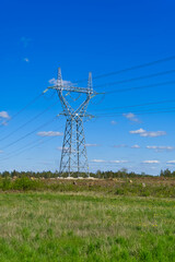 construction of new high voltage lines in forest. Estonia. new mast of a high voltage power line. installation of a high voltage power line.