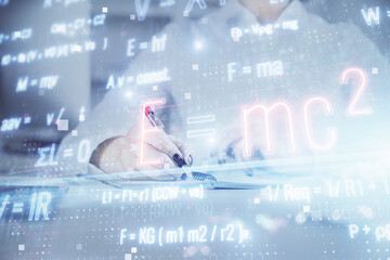 Science formula hologram over woman's hands taking notes background. Concept of study. Double...