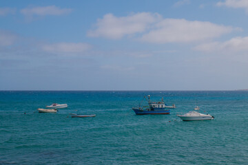 Pictures of the two main town (one the capital) in Lanzarote, Canary Island: Haria and Teguise, both with old white architecture and simple life. Typical are the  white houses with green windows 