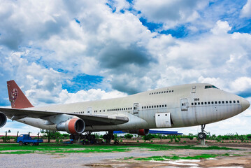 Nakhon Pathom, Thailand - June, 09, 2020 : The old commercial aircraft was discharged with a stormy sky at Nakhon Pathom, Thailand