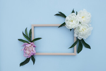 Flower arrangement of peonies. Spring, floral background. Frame with white and pink flowers on a light background. The concept of spring. Mother's Day, Women's Day. Flat lay, space for text.