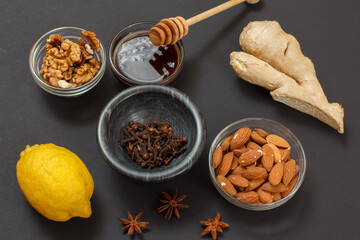 Health remedy foods for cold and flu relief on a black background.