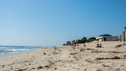 View on Malibu beach in the summer with seaside and people