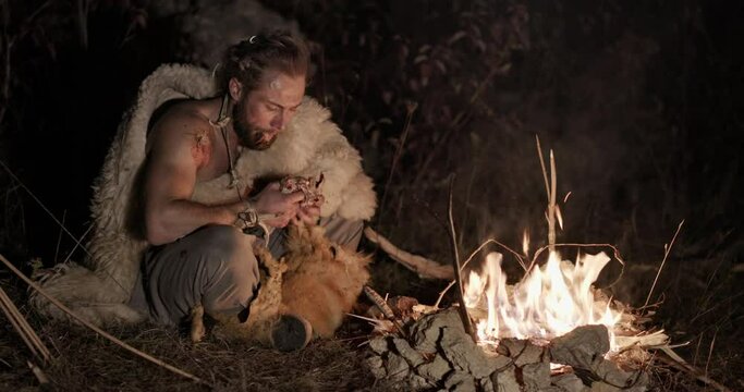 Barbarian resting near fire
