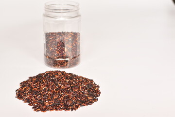 Red rice on a white background