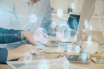 Fototapeta premium Double exposure of technology hologram with man working on computer background. Concept of big data.