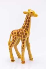 close up of a giraffe from a plastic toy isolated on a white background