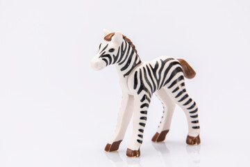 close up of a plastic stripped zebra isolated on a white background