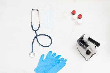 Stethoscope, medical mask, gloves, microscope.  Tools for medical  diagnosis in clinic.