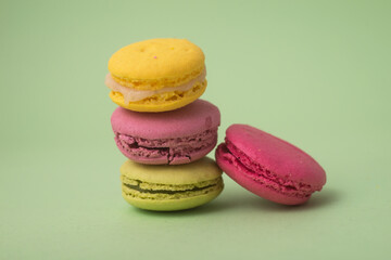 Closeup of french traditional macarons on green background