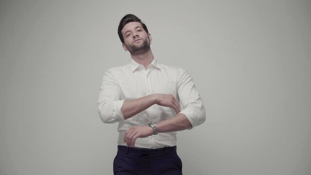Young handsome businessman isolated on gray background