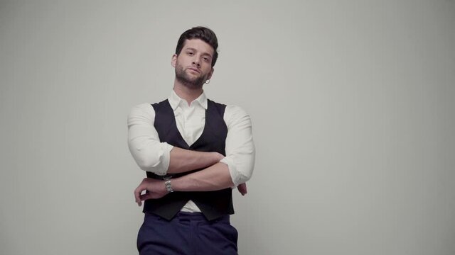 Young handsome businessman isolated on gray background