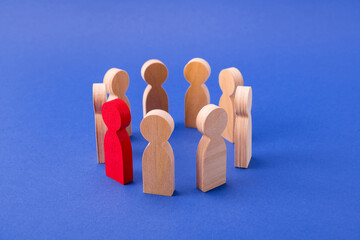 Wooden figures of people gathering standing in circle talking to one special guy talented businessman company owner isolated over bright vivid shine vibrant blue color background