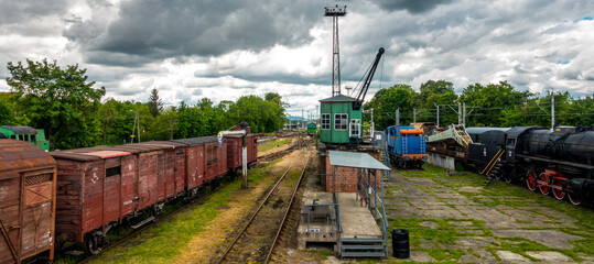 Rainy clouds over the railway station with trains standing on it © RITHOR