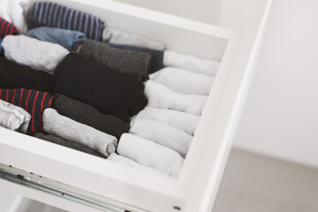 Socks storage idea in a small wardrobe or dresser. Wardrobe space organizing. Clothes Vertical storage