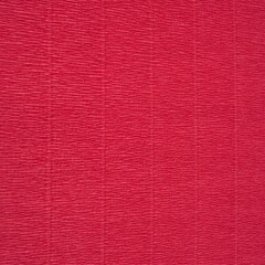Crepe crinkled Paper texture in pinky red, abstract background