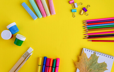 Fototapeta premium back to school. colorful stationery on yellow background