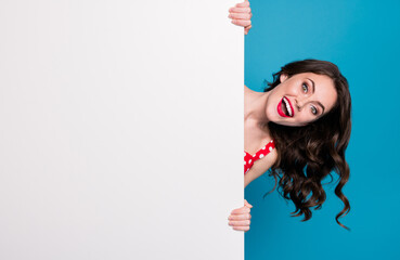 Photo of funny pretty excited lady hold hands side empty advert placard sales manager read...