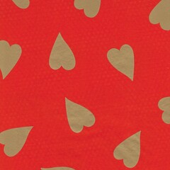 Gold hearts on red paper background
