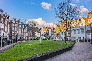World Famous historic Begijnhof (Beguinage, 1346) is one of the oldest courts in the city of Amsterdam. Begijnhof founded during the middle Ages. Amsterdam, Netherlands.