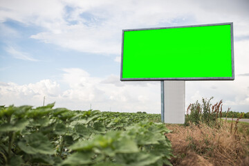 A blank advertising billboard next to the main road