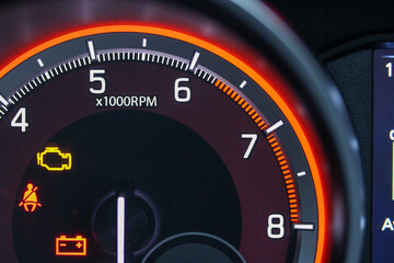 Close up of tachometer with warning lights
