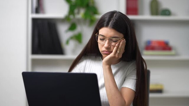 young girl works on the computer in her office