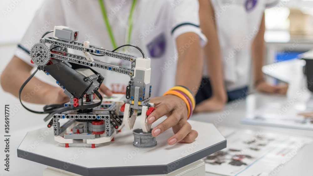 Wall mural robotic lab class with school students blur background in ai learning or group study workshop in sci