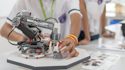 Robotic lab class with school students blur background in AI learning or group study workshop in science technology engineering classroom for STEM education