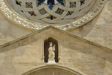 Trapani: Detail of the church of Sant'Agostino, on the Gothic-style portal inside a niche, there is...