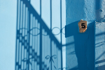 architectural details of Juzcar, Spanish city of Malaga. Located in the Genal Valley in the Serranía de Ronda. The town was painted blue as the setting to shoot a famous movie.