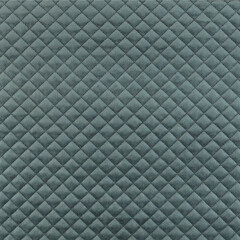Velvet upholstery quilted fabric texture in charcoal grey