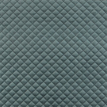 Velvet upholstery quilted fabric texture in charcoal grey