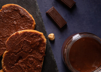 Homemade cocoa cream toast on a dark blue background