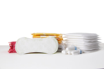different menstrual sanitary cotton pads and tampons on white background. Feminine hygiene products. copy space.