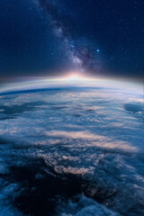 View of stars and milkyway above Earth from space. Beautiful space view of the Earth with cloud formation