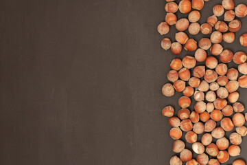 hazelnuts on a black background. top view on the right side