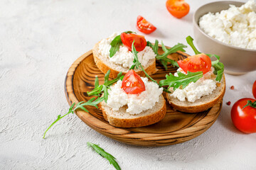 Healthy and tasty snack with bread, tomatoes and cottage cheese