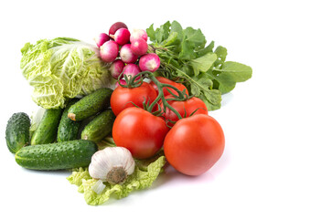 vegetables tomatoes, lettuce, radishes, mushrooms champignon , cucumbers, garlic on a white isolated background